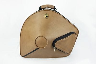 Cover in leather light brown with metal logo