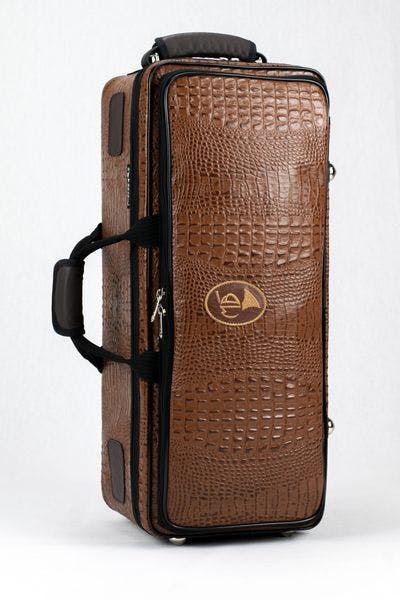 Cover in leather crocodile design and brown logo